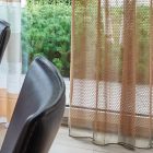 Mogyorószínű hímzett Gardisette függöny apró mintákkal